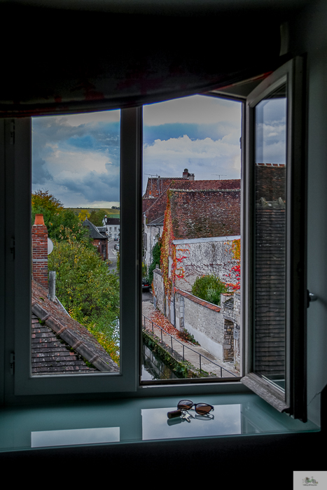 Window sill looking through to the view of the courtyard of Domaine Long-Depaquit