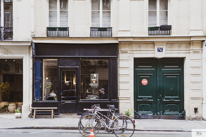 Bikes parked outside of Parisian shops