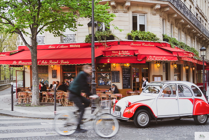 Man cycling through Parisian streets