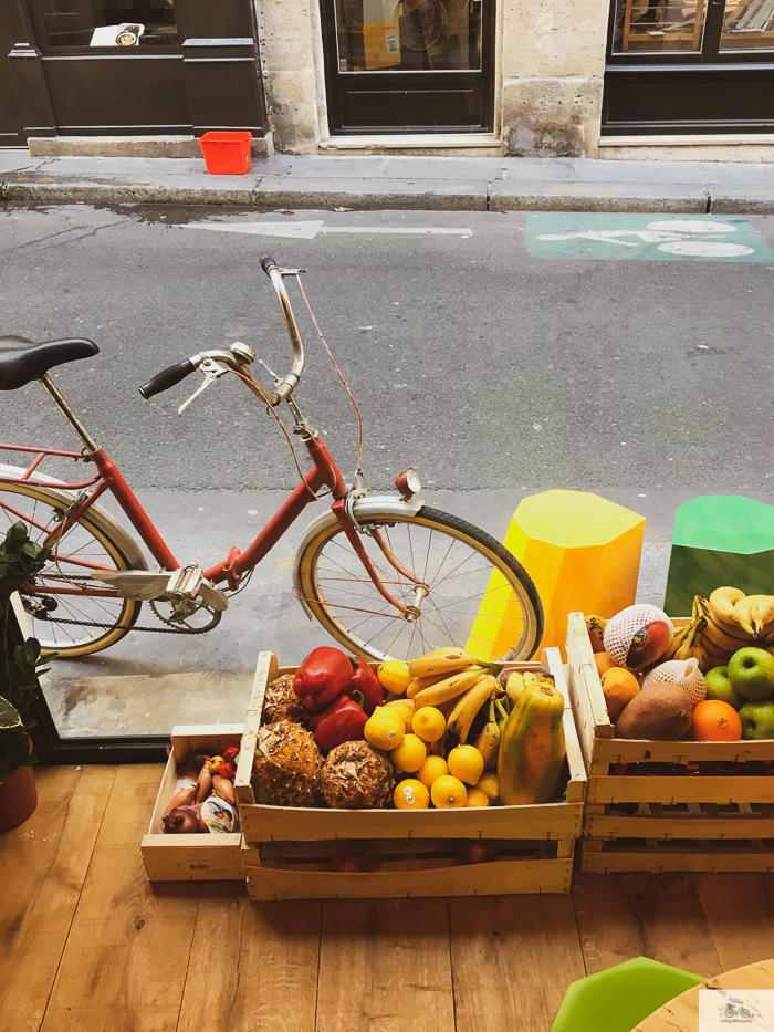Bike parked next to two fruit baskets