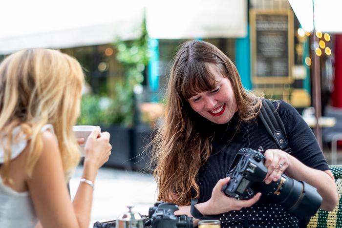 Krystal Kenney showing Julia a photo from her digital camera excitedly